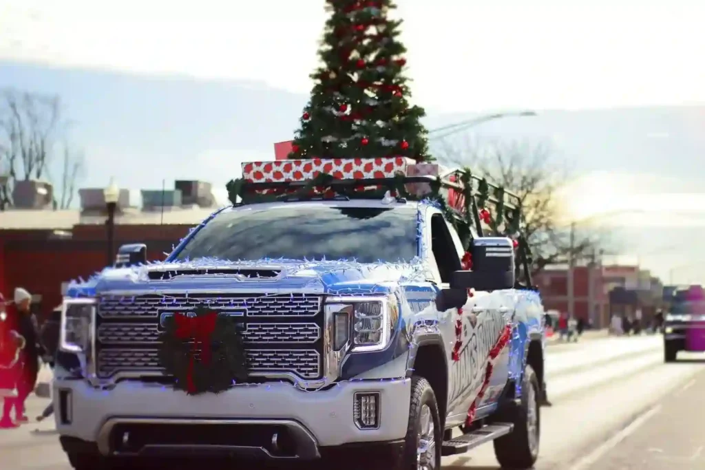 Decorated truck with Christmas tree in parade