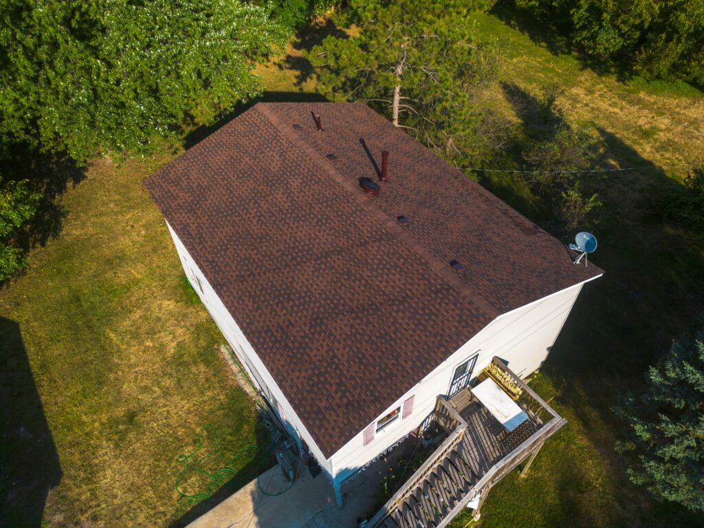 brown shingle roof drone view