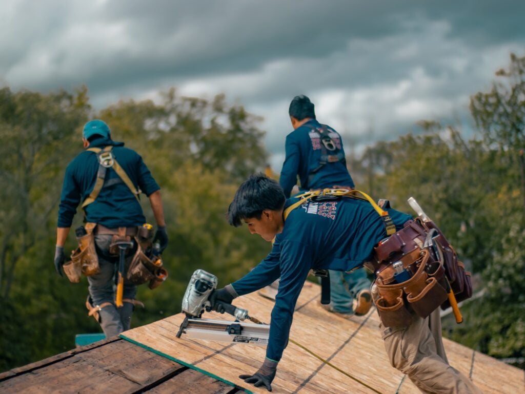 Ivan's Roofing crew working on a roof installation