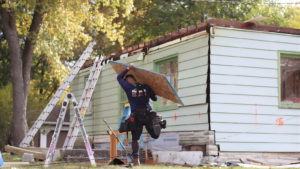 roof replacement process Indiana crew working on residential roof replacement in Highland Indiana