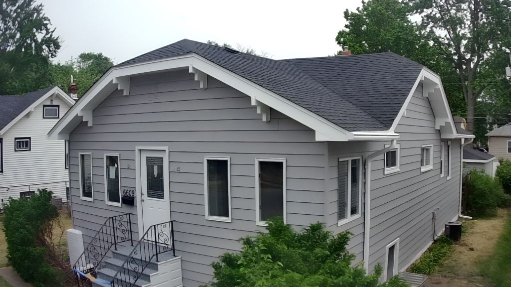 roof valley repair Indiana contractor inspecting a roof valley for leak damage