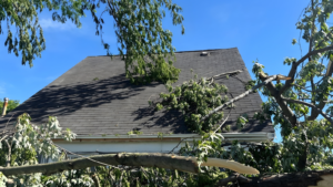 emergency roof repair Indiana contractor inspecting storm damaged roof after severe weather