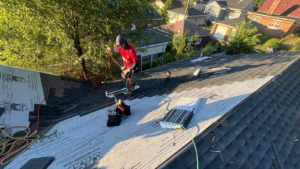 post storm roof inspection Indiana professional inspecting roof after severe weather in Northwest Indiana