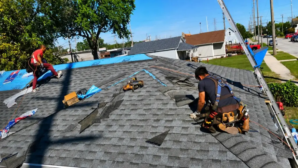 Roof replacement contractor Indiana discussing roofing options with a homeowner
